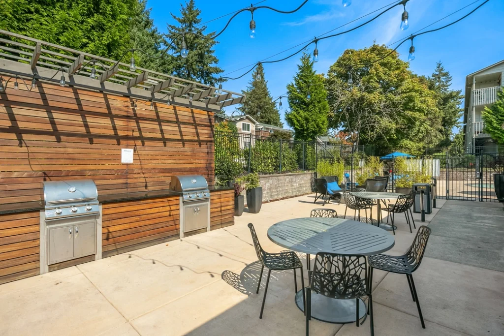 Outdoor grilling stations with dining tables