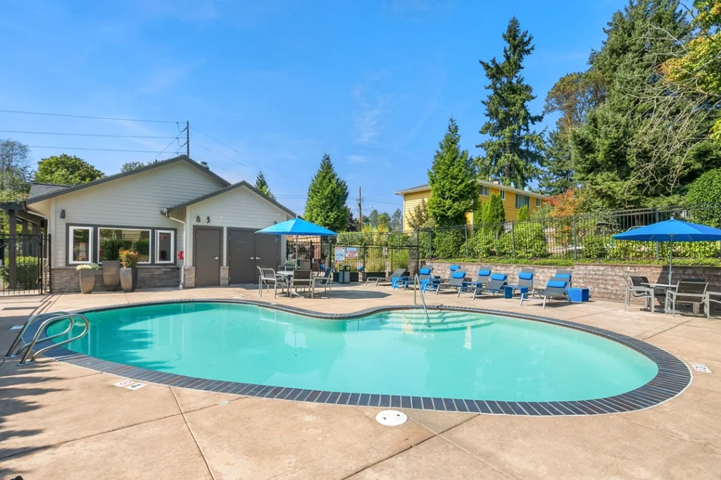 Swimming pool with loungers at Skyview 3322 apartments in Kent, WA