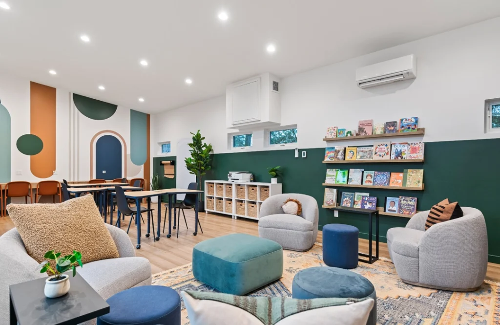 Kids club interior, flexible seating and activity stations